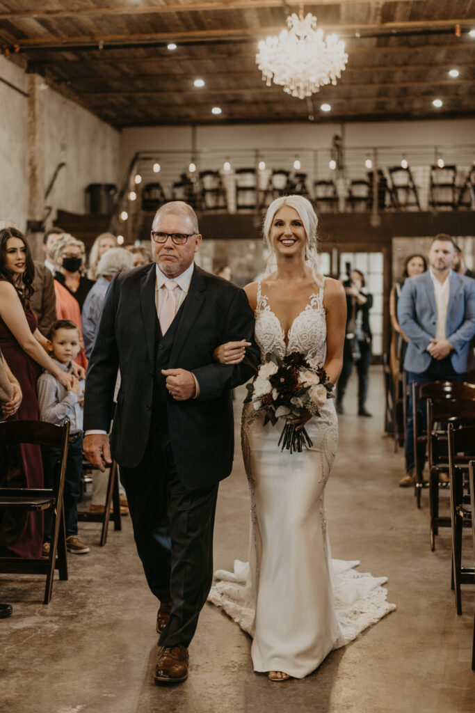 Bride and father walk down the aisle at Venue 102